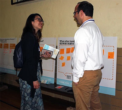 Two people talking at meeting